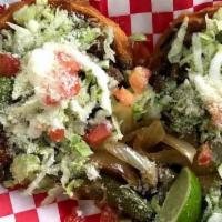 Sope · Fried tortilla with a choice of meat, comes with beans, lettuce, tomato, sour cream and chee...