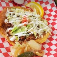 Tostada · Hard shell tortilla with any choice of meat, comes with beans lettuce, tomato, sour cream an...