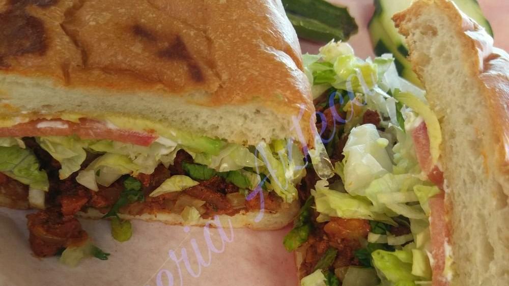 Torta · Pinto bean, a type of meat, lettuce, onion, tomato, avocado, and sour cream.