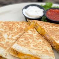 Bulldog Quesadillas · A large flour tortilla generously filled with a blend of delicious melted cheeses and pico d...