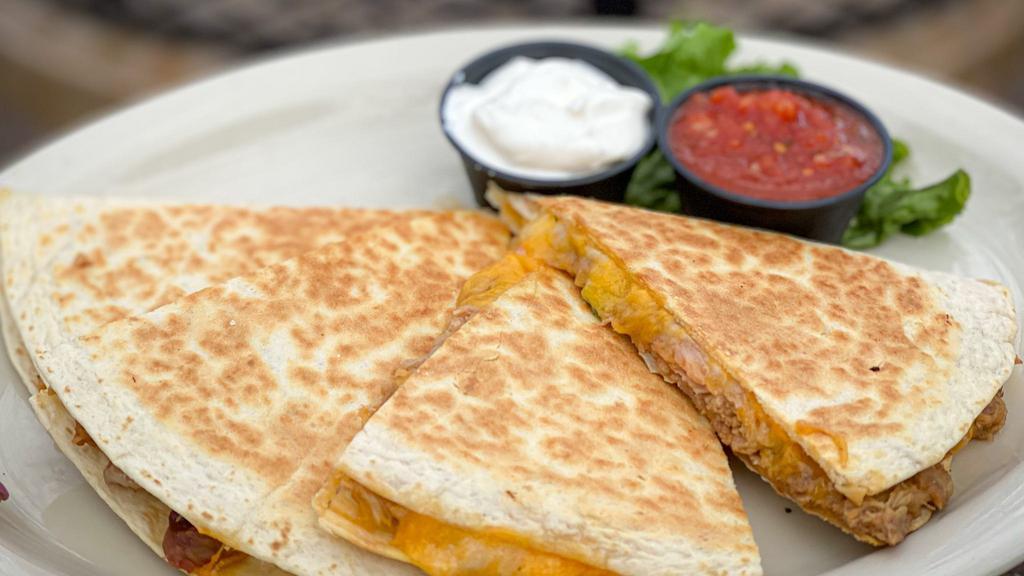 Bulldog Quesadillas · A large flour tortilla generously filled with a blend of delicious melted cheeses, and pico de gallo. Served with sour cream, and salsa.