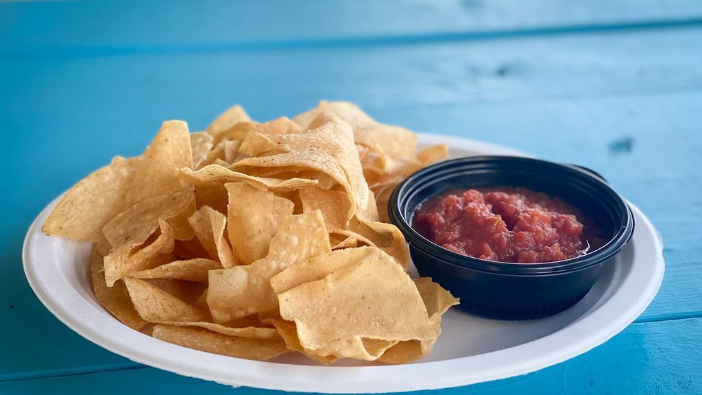 Chips And Salsa · Large portion of crispy corn tortillas with a side of house-made salsa.