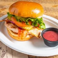 California Fire-Grilled Chicken Sandwich · Grilled chicken breast, applewood-smoked bacon, and guacamole with raspberry walnut vinaigre...