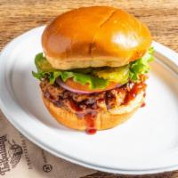 Roasted Pulled Pork Sandwich · Slow roasted pork shoulder shredded and simmered in sweet or spicy bbq sauce. Served on a to...