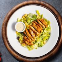 Classic Caesar Salad  · Crisp romaine lettuce, parmesan cheese and crunchy croutons. Served with caesar dressing on ...