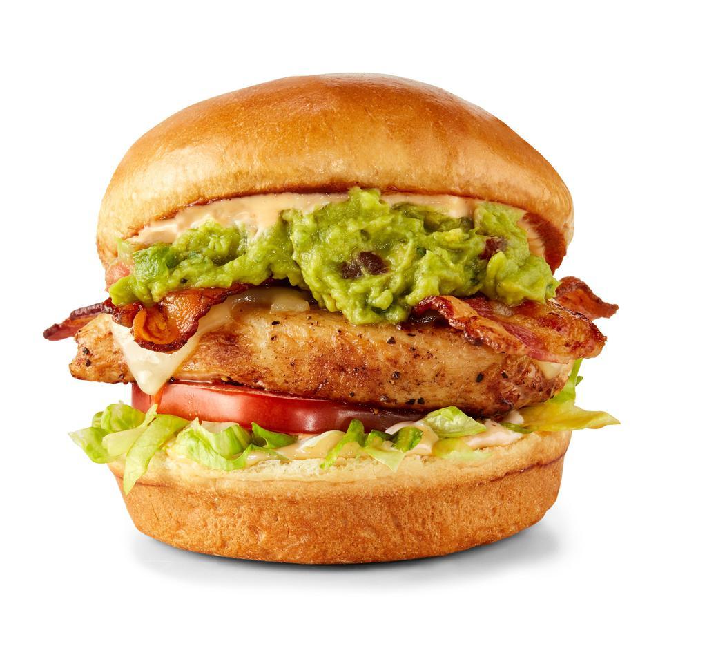 Grilled Chicken Club Sandwich · Grilled chicken breast topped with Swiss cheese, bacon, guacamole, bacon aioli, lettuce and tomato, served on a Challah bun.
