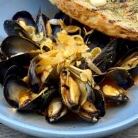 Mussels · Tomato saffron broth, fregola, shaved fennel, calabrian aioli, grilled bread