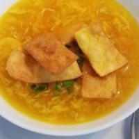 Egg Drop Soup · Smooth and soft broth, julienne carrots, and green onions.