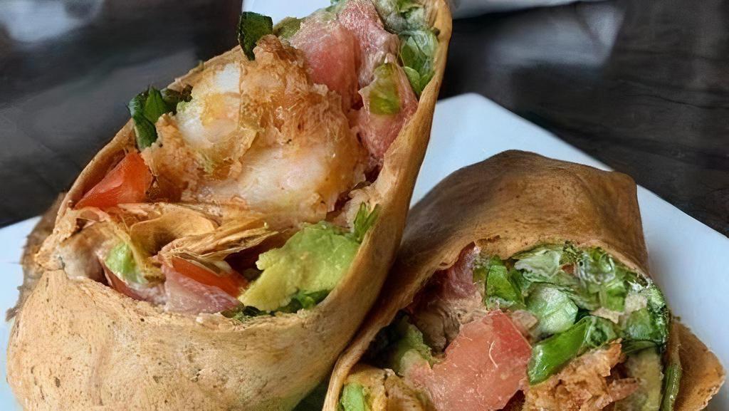 Cajun Shrimp Wrap · Hand breaded Cajun fried shrimp, lettuce, tomato and avocado rolled in a chipotle wrap served with chipotle aioli.