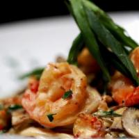 Southern Most Pasta Dinner · Louisiana crawfish tails, shrimp, portabella mushrooms, green onions on fettuccine with caju...