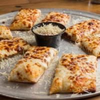 Legendary Cheese Sticks · Our legendary cheese sticks are loaded down with Mozzarella cheese, brushed with garlic butt...