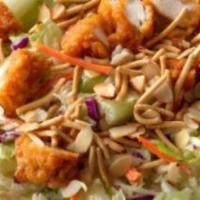 Asian Chicken Salad · Iceberg lettuce, house marinated Asian chicken, roasted red peppers, green and red cabbage, ...