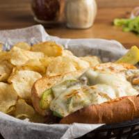 Philly Cheese Steak · Ribeye steak is cooked with sautéed peppers and onions and topped with melted provolone chee...