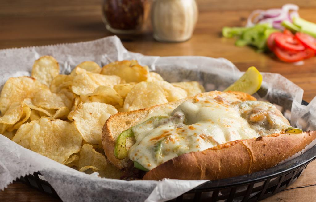Philly Cheese Steak · Ribeye steak is cooked with sautéed peppers and onions and topped with melted provolone cheese on a toasted hoagie (white or wheat). Served with choice of chips or pasta salad.