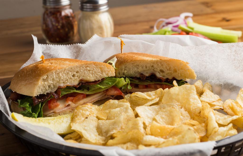 Turkey Melt · Smoked turkey, bacon, Swiss cheese, tomatoes, and mayonnaise work together to provide a simple yet delicious sandwich. Served on a hoagie bun (white or wheat) and a choice of chips or pasta salad.