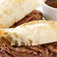 Roast Beef Dip · We begin this sandwich with a hoagie bun (white or wheat), then pile it high with roast beef...