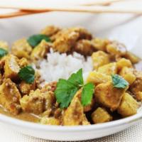 Curry Chicken · Curry chicken served with white rice.