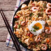 House Special Fried Rice · Rice with roast pork, shrimp, chicken, beef, onions, carrots, and peas.