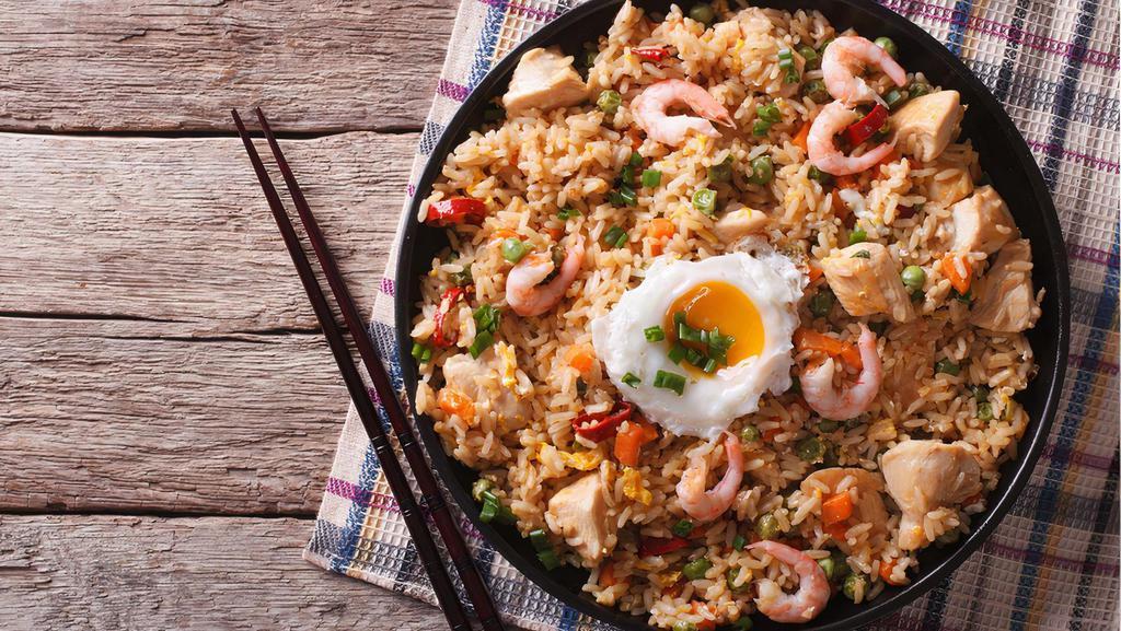 House Special Fried Rice · Rice with roast pork, shrimp, chicken, beef, onions, carrots, and peas.