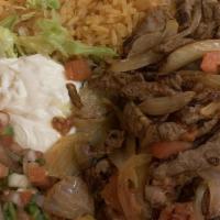 Fajitas · Steak, chicken, or mix sautéed with onions, bell peppers, and tomatoes. Served with rice, be...
