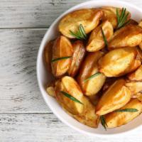Potato Wedges · Thick-cut potatoes, fried to perfection.