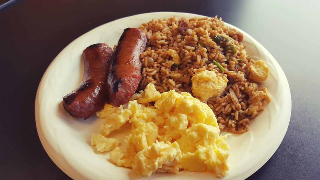 Breakfast Rice · Breakfast rice mixed with all meats, eggs, onions & bell peppers served with 2 sides.