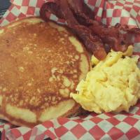 Pancakes Served With 2 Sides · 2 buttermilk pancakes served with scrambled eggs and choice of meat. Served with syrup.