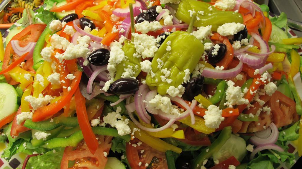 Greek Salad · Vegetarian. Gluten-Free. Romaine lettuce, red onions, tomato, cucumber, peppers, kalamata olives, feta cheese and pepperoncini.