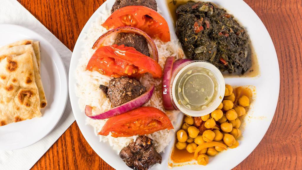 Lamb Kabob · Gluten-free. Marinated in fresh citrus and herbs served with roasted tomato and red onions.