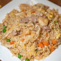 House Fried Rice · With chicken, beef, shrimp and vegetables.