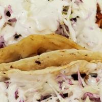Shrimp Tacos · Fresh shrimp seasoned and grilled with fresh pico De gallo, topped with cabbage, and our own...