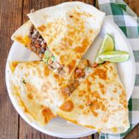 Carne Asada Quesadillas · Marinated steak strips seasoned and grilled then placed on a flour tortilla with melted chee...