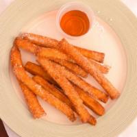 Funnel Fries · Funnel fry sticks lightly fried and sprinkled with powered sugar.