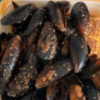 1Lb Black Mussels  · Includes Corn and Potatoes. Your choice of seafood sauce.