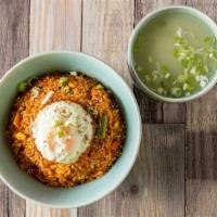 Kimchi Fried Rice · Fried rice with bacon, kimchi, chopped bell peppers, onions, carrots, mixed veggie, and frie...