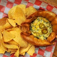 Spinach Dip · House-made spinach dip with green chili peppers, jalapeños, cream cheese, cheddar, and shred...