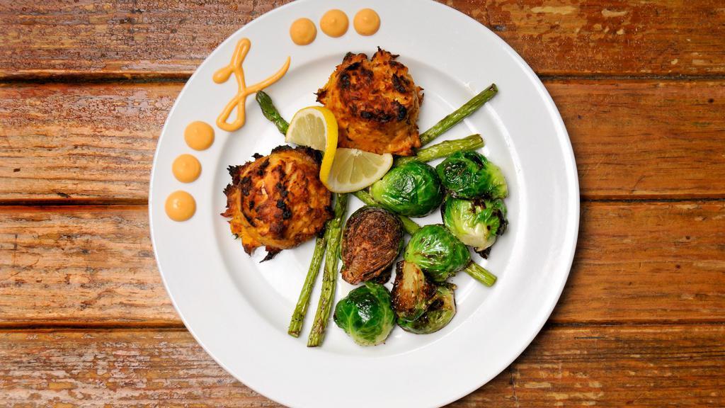 Salmon Cake Plate · Broiled, grilled, or fried salmon cakes made with large lumps of fresh salmon. Served with your choice of two sides and our zesty sriracha aioli.