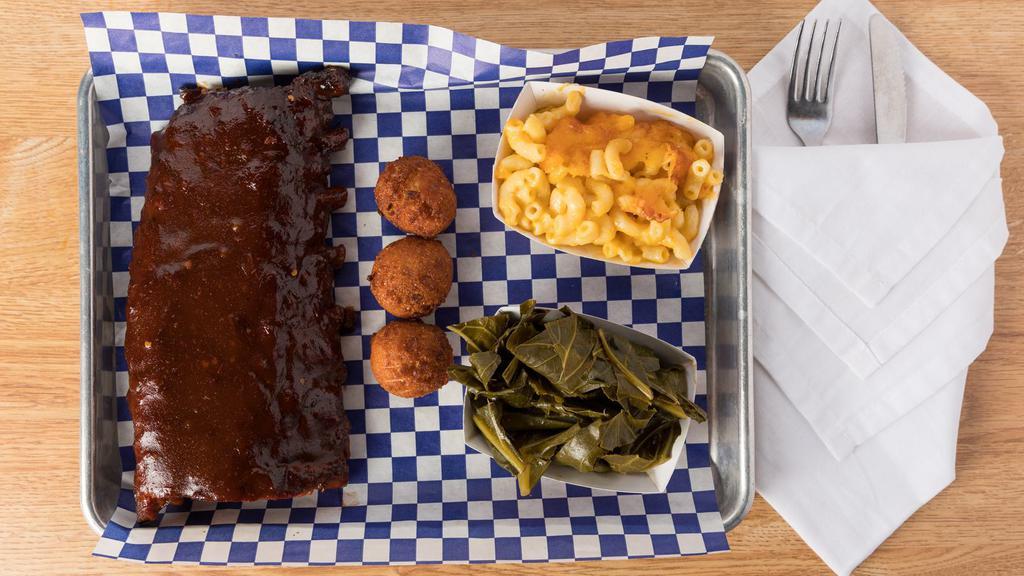 1/2 Rack · 1/2 rack of our slow-smoked, fall-off-the-bone baby back ribs with your choice of two sides.