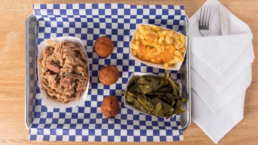 Pulled Pork Bbq Plate · Hickory smoked low and slow pulled pork with your choice of two sides.