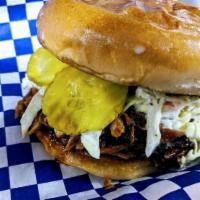 Pulled Rib Meat Sandwich · Pulled rib meat with our sweet sauce and topped with pickles and slaw served on a butter -to...