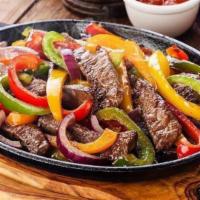 Fajitas · Tender beef or chicken sautéed with bell peppers, tomatoes and onions. Served with sour crea...