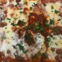 Lasagna (Family Style) · Serves 5-6 people and it comes with salad and bread.