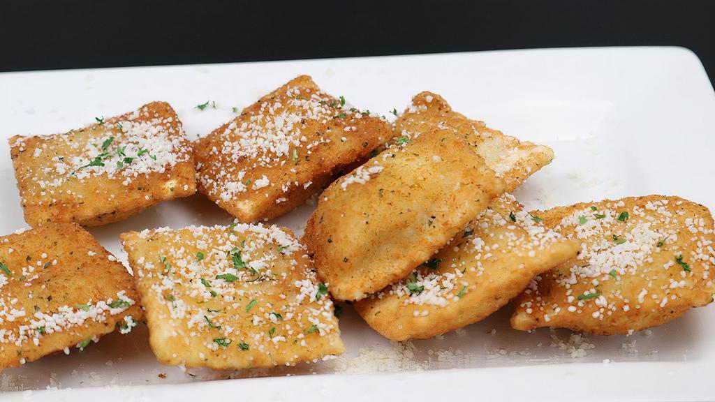 Toasted Ravioli · Italian cheese filled ravioli, lightly breaded. Served with classic red sauce.