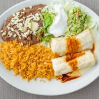 Lunch Size Chimichanga · Fried or soft tortilla filled with chicken or beef, topped with white queso, red sauce, lett...