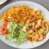 Shrimp A La Mexicana · Grilled shrimp with jalapeno peppers, onions, tomatoes, rice, guacamole salad and three tort...