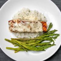 Scottish Salmon · Grilled and topped with a white wine lemon butter sauce on mashed potatoes with green beans.