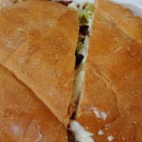 Carne Asada Torta · Grilled steak. Served on torta bread with refried beans, mayo, lettuce, tomato, queso fresco...