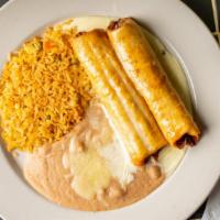 Chimichangas · Two flour tortillas, fried or soft, filled with chicken or ground beef, topped with queso di...