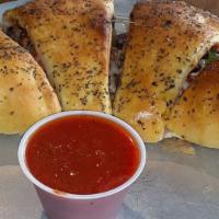 Calzones · Mozzarella and parmesan with choice of two toppings. Marinara on the side.