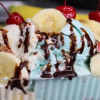 Banana Split · Three scoops of ice cream, one banana, wip cream, chocolate syrup three cherrys.
